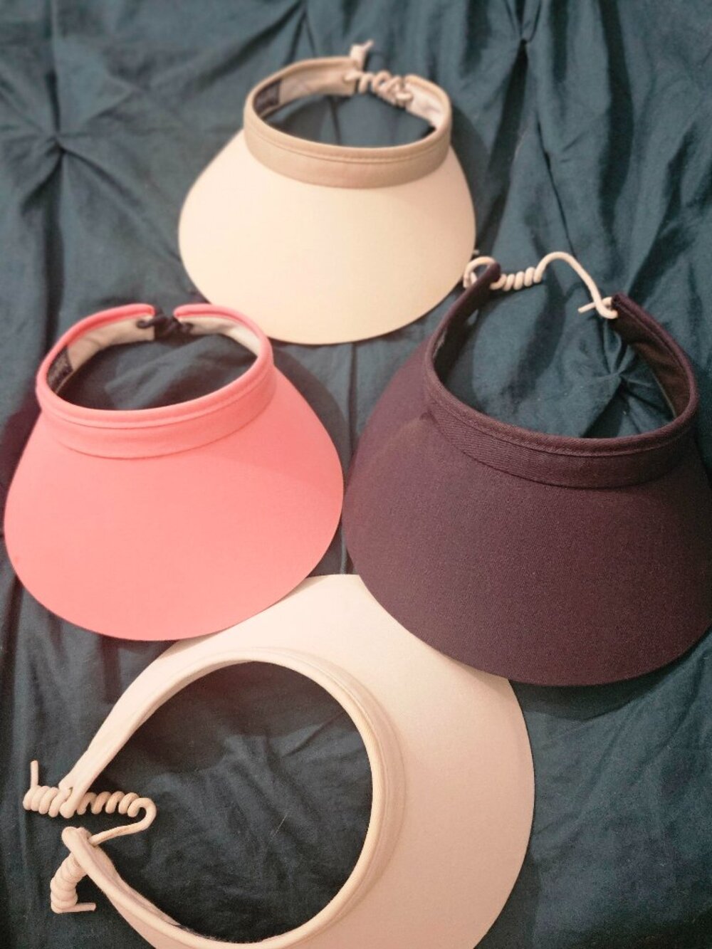 Four sun visors